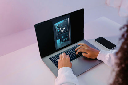 Person using a laptop with 'Delta Access' software on a blurred background