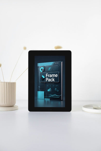 Digital frame with a display of 'Frame Pack' on a white surface.